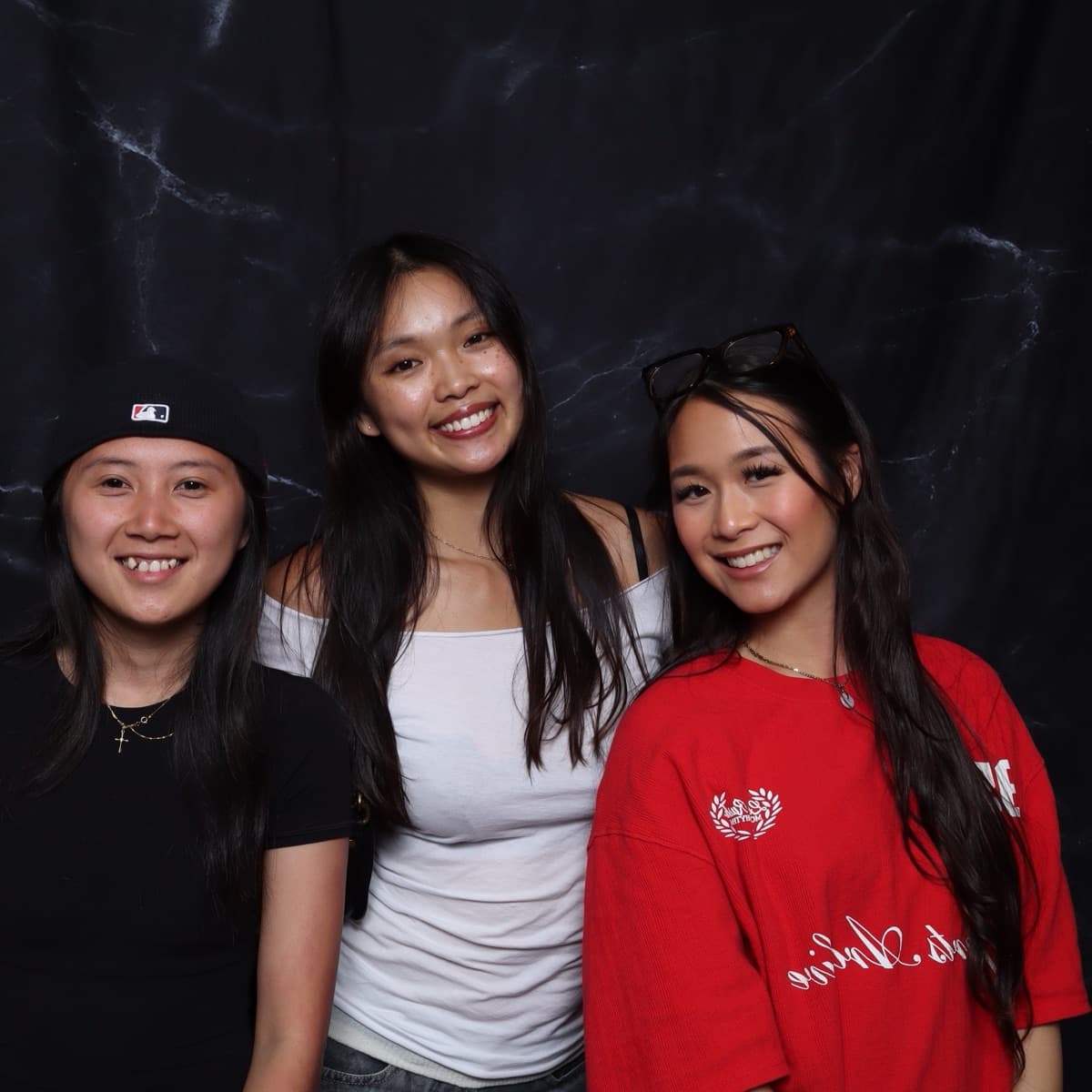three friends posing together